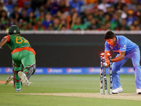Umesh Yadav (right) runs out Bangladesh's Imrul Kayes during their 2nd quarter-final match