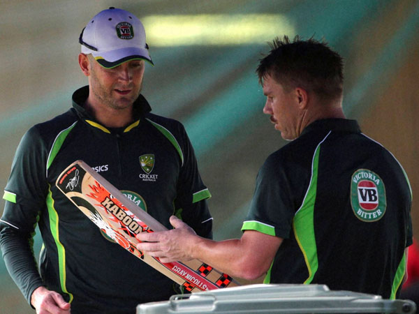 Captain Clarke (left) and Warner at practice today