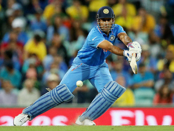 Dhoni plays a shot in the semi-final. He topscored for India with 65