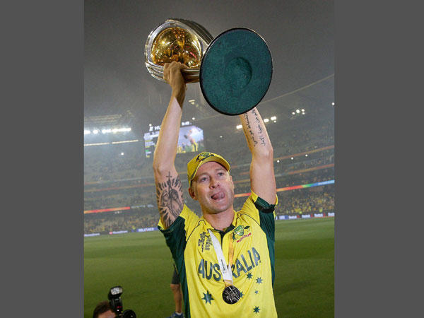 Captain Clarke holds the trophy aloft