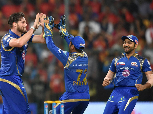 Mumbai Indians Mitchell McCleanaghan celebrates the wicket of Virat Kohli 