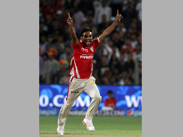 Kings XI Punjab player Sandeep Sharma celebrates