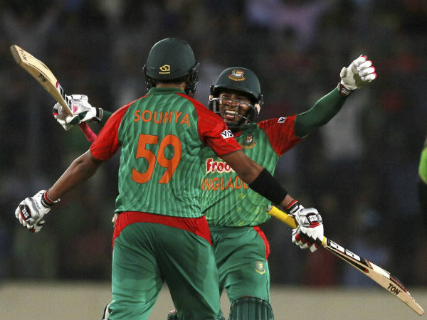 Mushfiqur Rahim, face to camera, and Soumya Sarkar prepare to embrace after winning