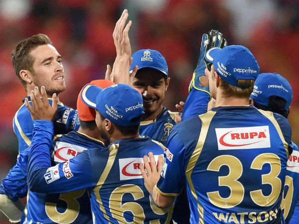 Tim Southee (left) celebrates with team-mates after dismissing Chris Gayle