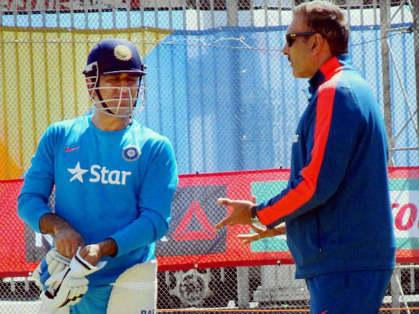 Dhoni and Ravi Shastri (right), India's interim coach