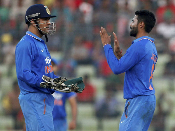 Ravindra Jadeja (right) and Dhoni react after the former dismissed Sabbir Rahman