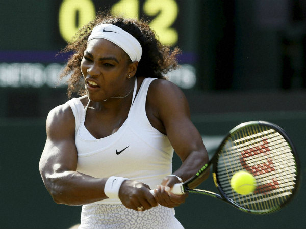 Serena Williams of the United States returns a ball to Heather Watson of Britain 
