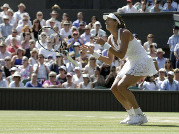 Garbine Muguruza of Spain celebrates after defeating Agnieszka Radwanska of Poland Garbine Muguruza of Spain celebrates after defeating Agnieszka Radwanska of Poland