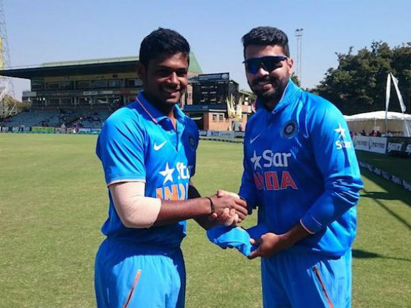 Samson receives his India cap from Vijay. Photo from BCCI's Twitter page