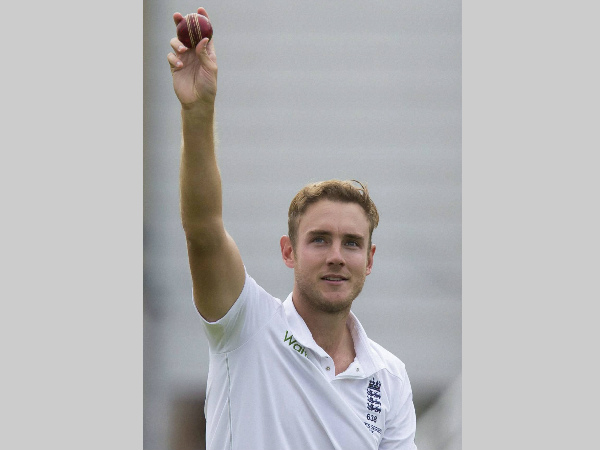Broad raises the ball after taking his 5th wicket