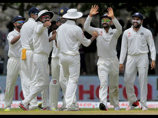 Indian players celebrate a wicket