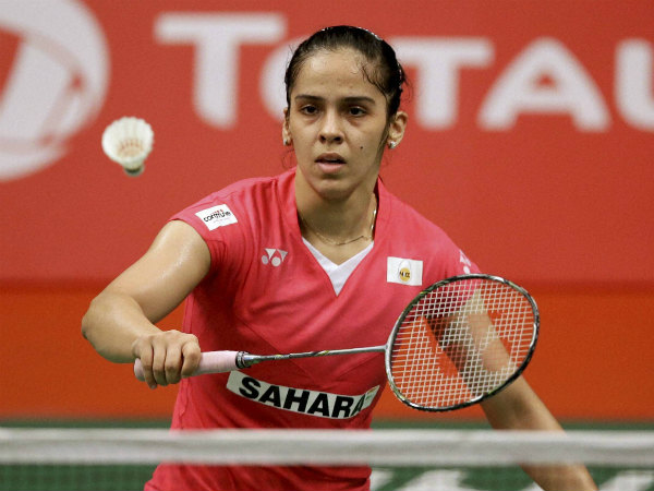 Saina Nehwal hits a backhand return to Sayaka Takahashi