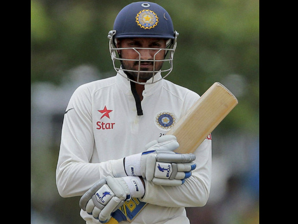 Harbhajan Singh walks back after his dismissal