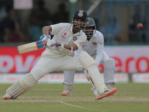 Rahane plays a shot on way to his century