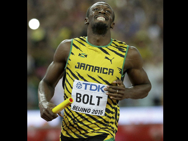 Usain Bolt smiles after anchoring their men's 4x100m relay team to victory