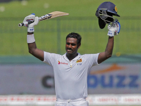 Mathews celebrates his century