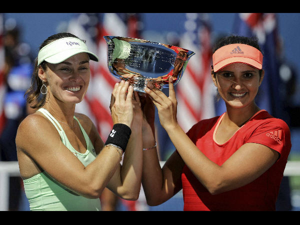 Martina (left) and Sania pose with their US Open trophy