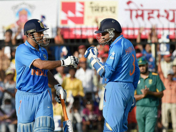 Harbhajan (right) with Dhoni in the 2nd ODI against South Africa in Indore