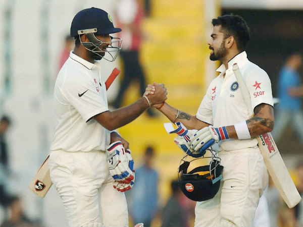 Pujara (left) and Kohli during their partnership