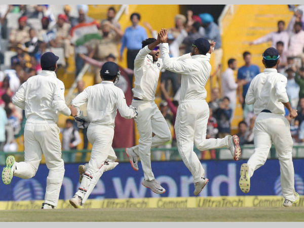 Jadeja (3rd left) celebrates with teammates after dismissing Amla