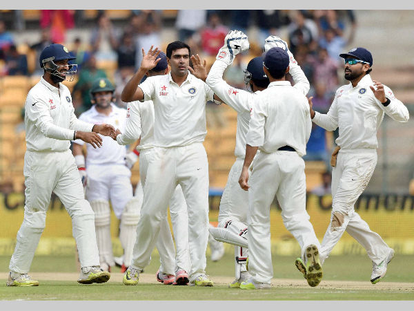 Ashwin, with teammates, celebrates the wicket of Stiaan Van Zyl
