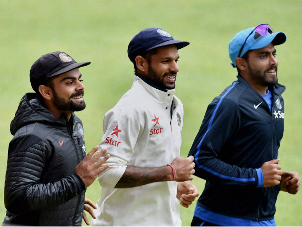 Kohli (left), Dhawan (centre) and Ravindra Jadeja run during a training session in Bengaluru