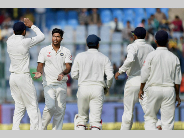 Umesh Yadav (2nd left) celebrates with team-mates after dismissing Dean Elgar