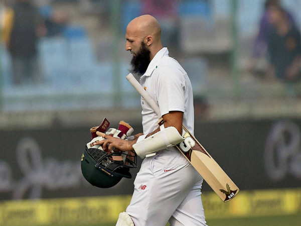 Amla returns to the pavilion after battling for 244 balls
