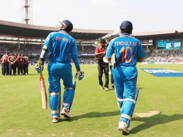 Sehwag (left) and Sachin walk out to bat for India in a ODI Sehwag (left) and Sachin walk out to bat for India in a ODI