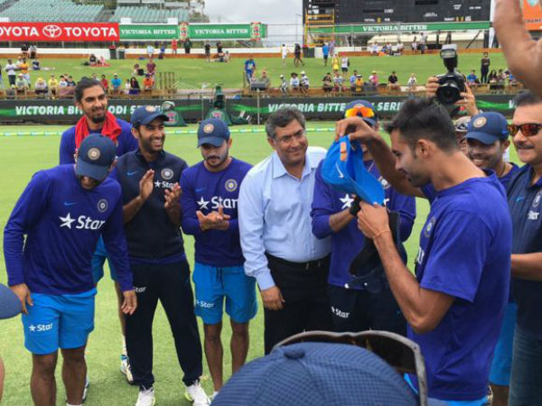 Sran is about to wear his India cap