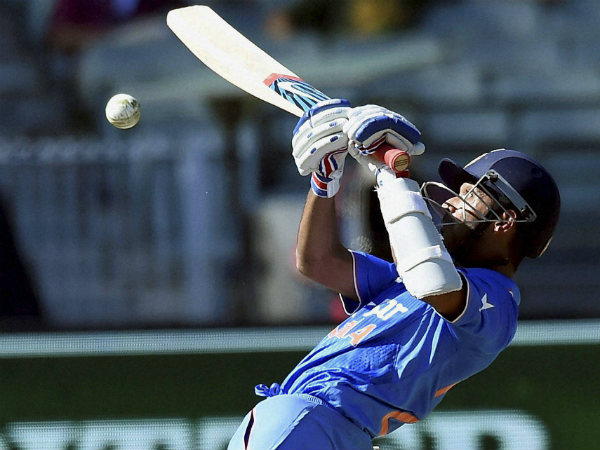 Rahane guides the ball over the wicketkeeper's head during his 50-run knock