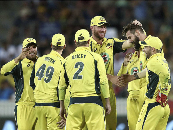 Australian players celebrate a wicket in Canberra