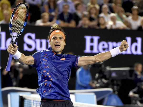 David Ferrer of Spain celebrates after defeating Lleyton Hewitt in 2nd round of Australian Open