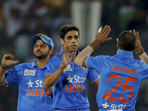 Nehra (centre) celebrates with Shikhar (right) and Raina after dismissing Sarkar in the final