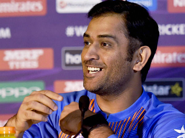 Dhoni smiles as he faces the media ahead of World T20