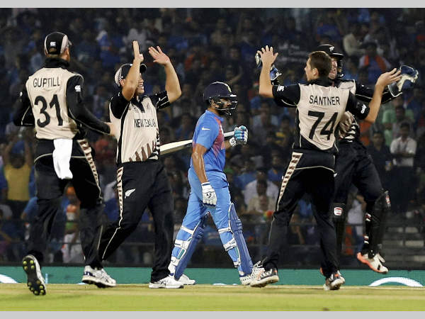 New Zealand players are ecstatic after the dismissal of Rohit Sharma