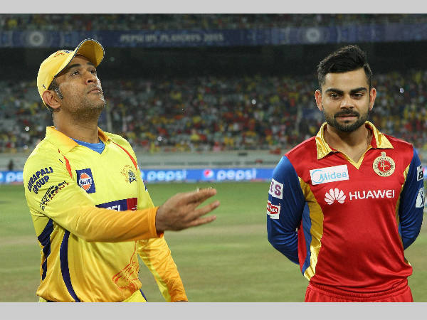 File photo: MS Dhoni (left) tosses the coin as Kohli watches during an IPL 2015 match between Chennai Super Kings (CSK) and RCB in Ranchi on May 22, 2015