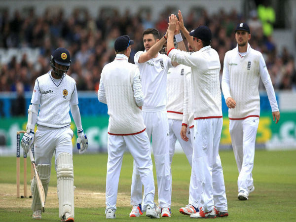 James Anderson, third left, celebrates after taking the wicket of Dimuth Karunaratne during day three of the first cricket Test at Headingley.