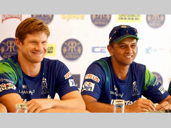 Watson (left) and Dravid smile during an event