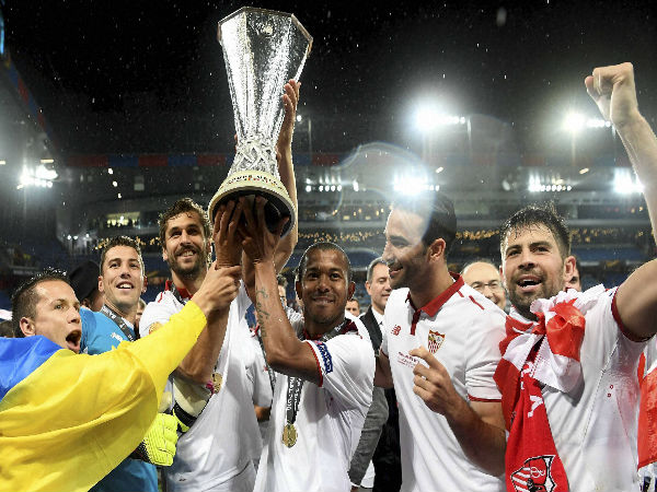 Sevilla's team players celebrates the victory with the trophy after the soccer Europa League final between England's Liverpool FC and Spain's Sevilla Futbol Club at the St. Jakob-Park stadium in Basel. Sevilla's team players celebrates the victory with the trophy after the soccer Europa League final between England's Liverpool FC and Spain's Sevilla Futbol Club at the St. Jakob-Park stadium in Basel.