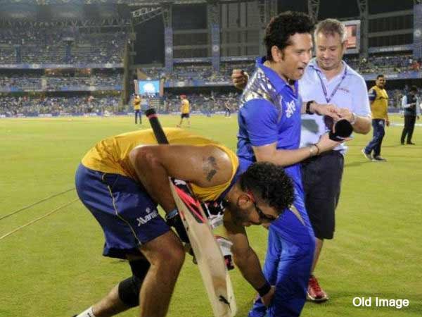 File photo. Yuvraj Singh touching Sachin Tendulkar's feet during IPL File photo. Yuvraj Singh touching Sachin Tendulkar's feet during IPL