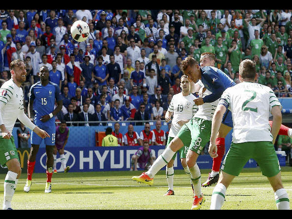 Antoine Griezmann scores on a header during the Euro 2016 round of 16 soccer match between France and Ireland, at the Grand Stade in Decines-Charpieu, near Lyon, France, on June 26, 2016. 
