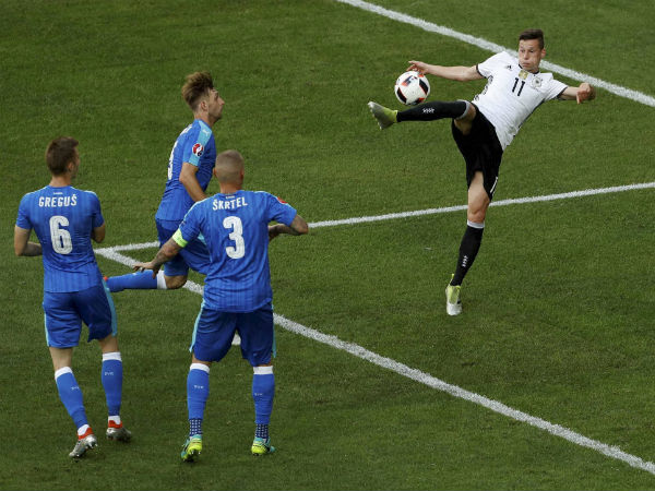 Germany's Julian Draxler scores his side's third goal during the Euro 2016 round of 16 soccer match between Germany and Slovakia, at the Pierre Mauroy stadium in Villeneuve d'Ascq, near Lille, France, on June 26, 2016. 
