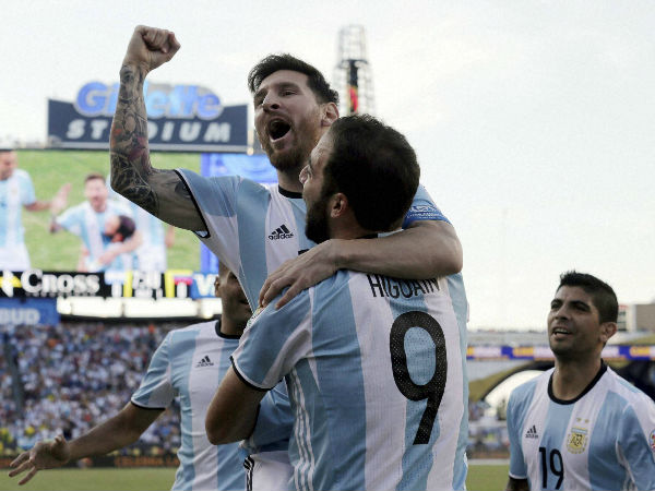 File photo: Argentina's Lionel Messi, top, celebrates a goal by Gonzalo Higuain (9) during the first half of a Copa America Centenario quarterfinal soccer match against Venezuela on Saturday, June 18