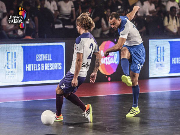 Cafu (blue) attempts a shot