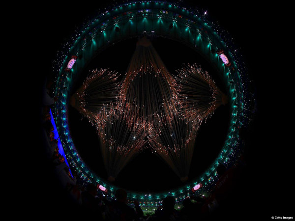 Five rings of the Olympics depicted with fire