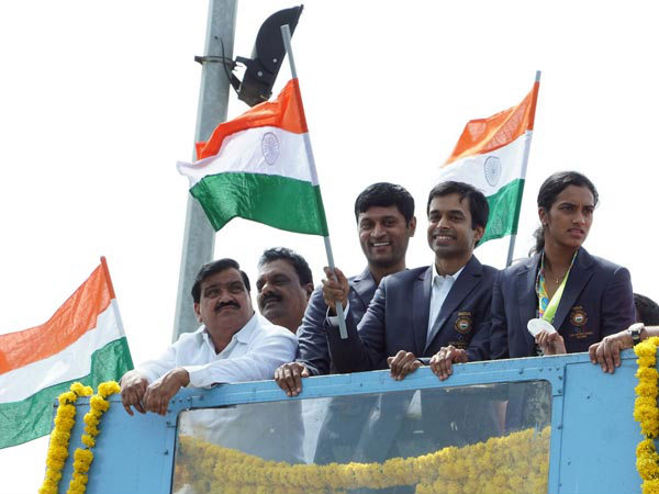 Pullela Gopichand and PV Sindhu on open-top bus