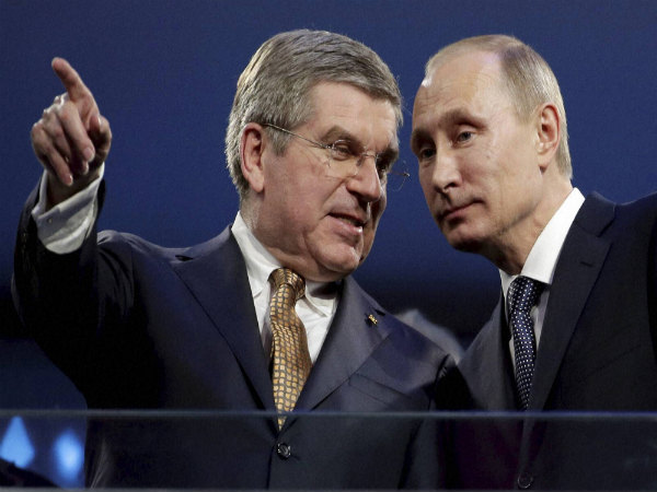 International Olympic Committee President Thomas Bach (left) and Russian President Vladimir Putin watch the closing ceremony of the 2014 Winter Olympics in Russia International Olympic Committee President Thomas Bach (left) and Russian President Vladimir Putin watch the closing ceremony of the 2014 Winter Olympics in Russia