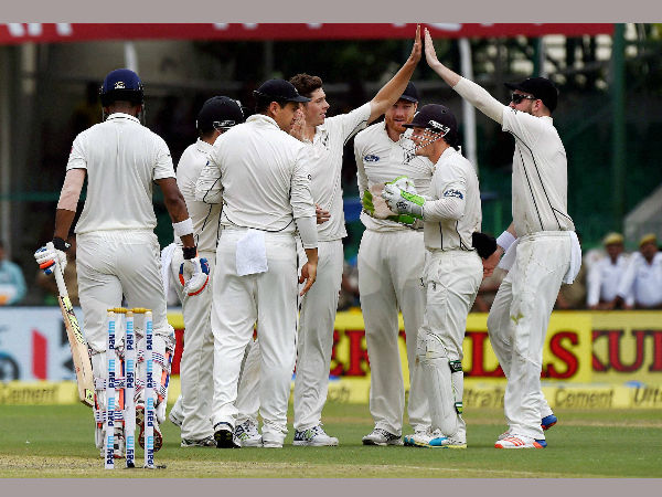Mitchell Santner celebrates with his teammates after dismissing K.L. Rahul on the opening day of the first Test match at Green Park in Kanpur on Thursday.