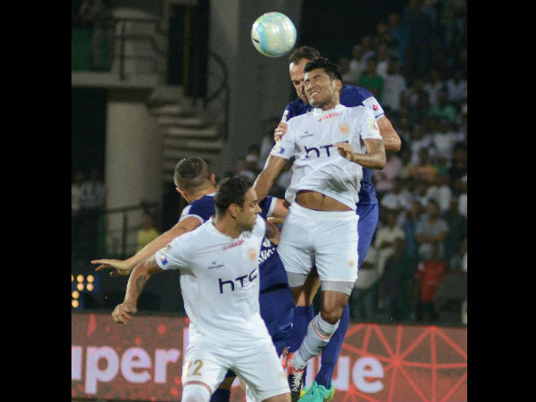 Players of Northeast United FC (in white jersey) and Chennaiyin FC (in blue jersey) vie for the ball during the ISL match at Indira Gandhi Athletics Stadium, in Guwahati on Thursday. Players of Northeast United FC (in white jersey) and Chennaiyin FC (in blue jersey) vie for the ball during the ISL match at Indira Gandhi Athletics Stadium, in Guwahati on Thursday.